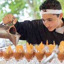 a student pours out something delicious in our culinary class