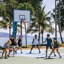 JCU student play basketball by the beach