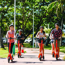 JCU students on electric scooters