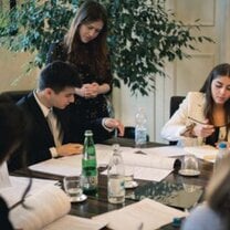 Students working with lawyer