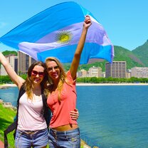 Women holding Argentina's flag