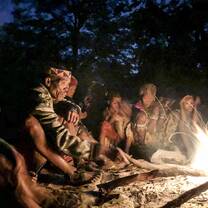 San Bushmen sitting around the fire at a Healing dance event