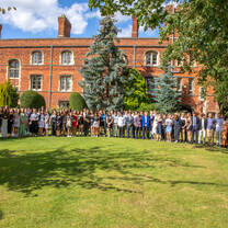 Students standing outside Jesus college in Cambridge