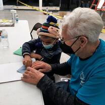 Volunteers working with children at the Refugee Respite Center