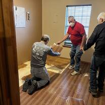 Volunteers removing flooring in San Juan, Texas