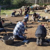 Students digging at excavation site