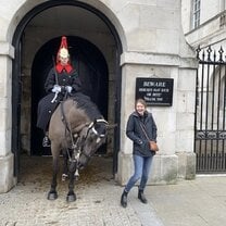 Buckingham Palace guard and his horse with a student. 