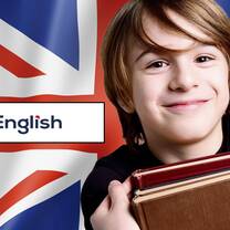 Headshot of student with books in front of British flag