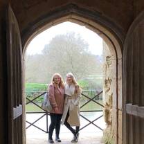 Two students on a balcony in Bodiam Castle