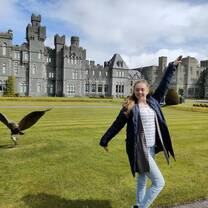 Posing next to bird in front of Castle