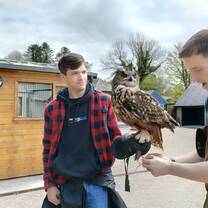 Posing with fierce bird