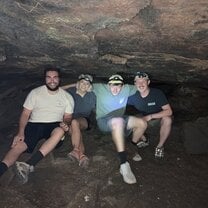 Group of peope in a cave 