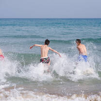 CAMPERS SWIMMING AT THE BEACH AT IBERIAN CAMPS