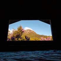 Window view to the Anhangava Mountain 