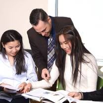 professor teaching two girls