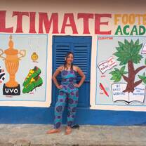 In front of the new hostel painting