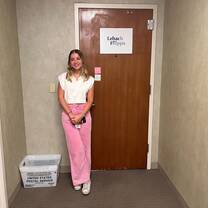 Law Intern in NYC office in front of door