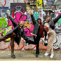 students pose in london