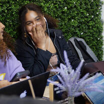 two students laugh together 