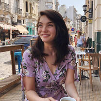 student smiles in front of street in buenos aires