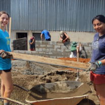 students doing construction service work 