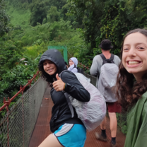 students hiking in rainforest