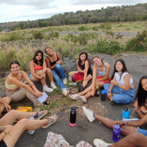students gathered in a circle relaxing 