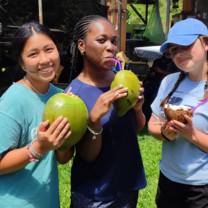 students drinking coconuts