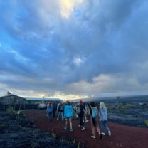 students walking home under big clouds 