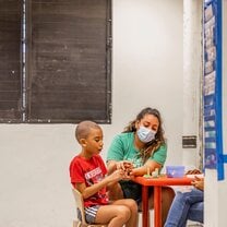 Woman helping children