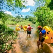 Volunteers carrying yellow tubes