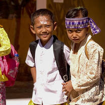 Two children going to school.