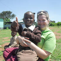 volunteer with a young girl