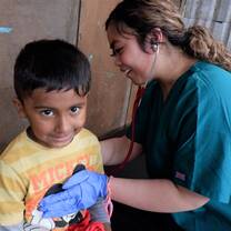 Using a stethoscope on the intro to pre-med program