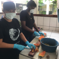 Volunteer preparing food