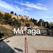 Student in front of Malaga sign