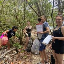 volunteers cleaning mangrove paths to prevent the garbage running off into the ocean