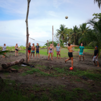 Students playing volleyball on a beach in Costa Rica