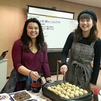 CET Japan study abroad student and local roommate cook together at a program activity