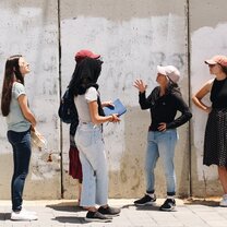 Yahel Volunteers stand by the border wall in East Jerusalem and learn about the geopolitics of east Jerusalem