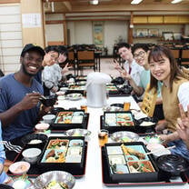 CET Japan study abroad students and local roommates enjoy lunch in a restaurant