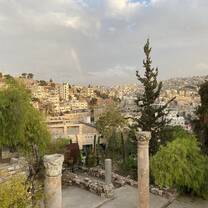 Landscape view of downtown Amman with a rainbow