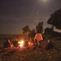 A late night beach campfire