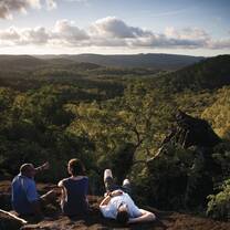 A trio looks out onto a beautiful vista