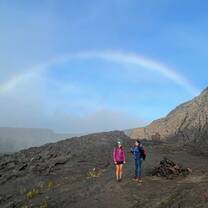 Rainbow over student and Overseas Educator