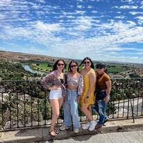 Interns walking through Madrid’s historic streets with cafes and landmarks around them
