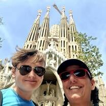selfie of two students smiling in front of La Sagrada Familia