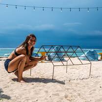 Preparing a coral frame during the reef restoration week at Blue Corner Dive Nusa Lembongan