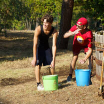 Two boys with buckets