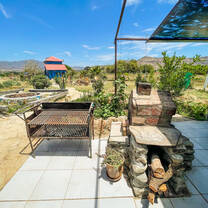 The grill and rocket stove at the Smurf House